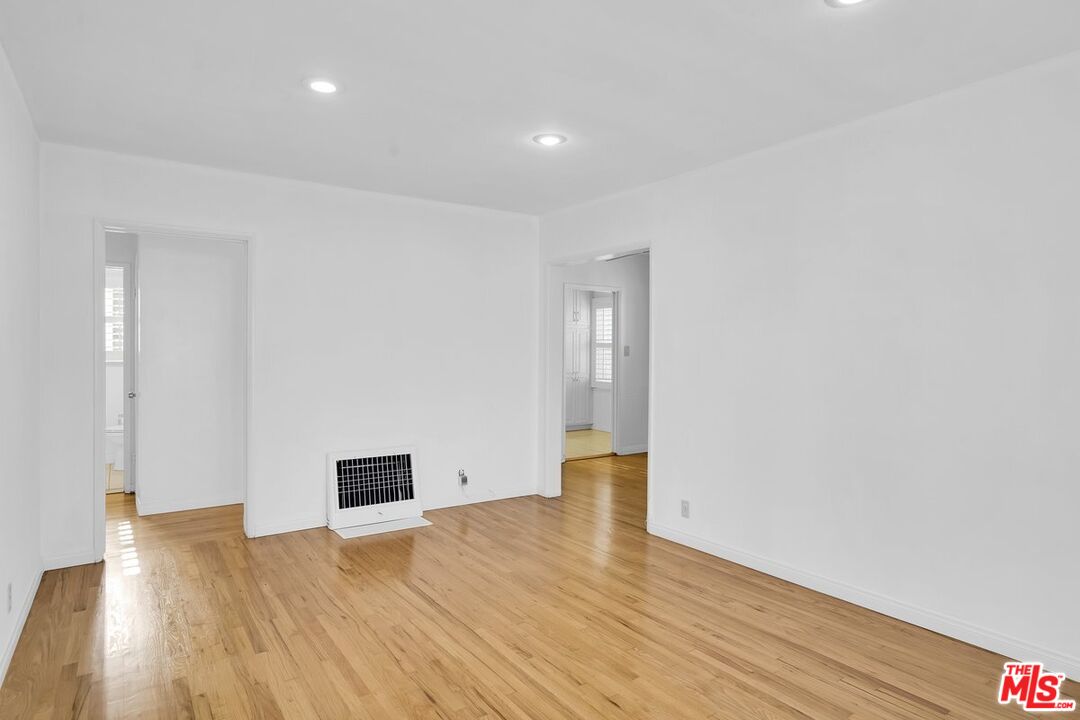 1316 South Castlegate Avenue Compton, CA 90221 - Photo 5 of 28 a view of empty room with wooden floor