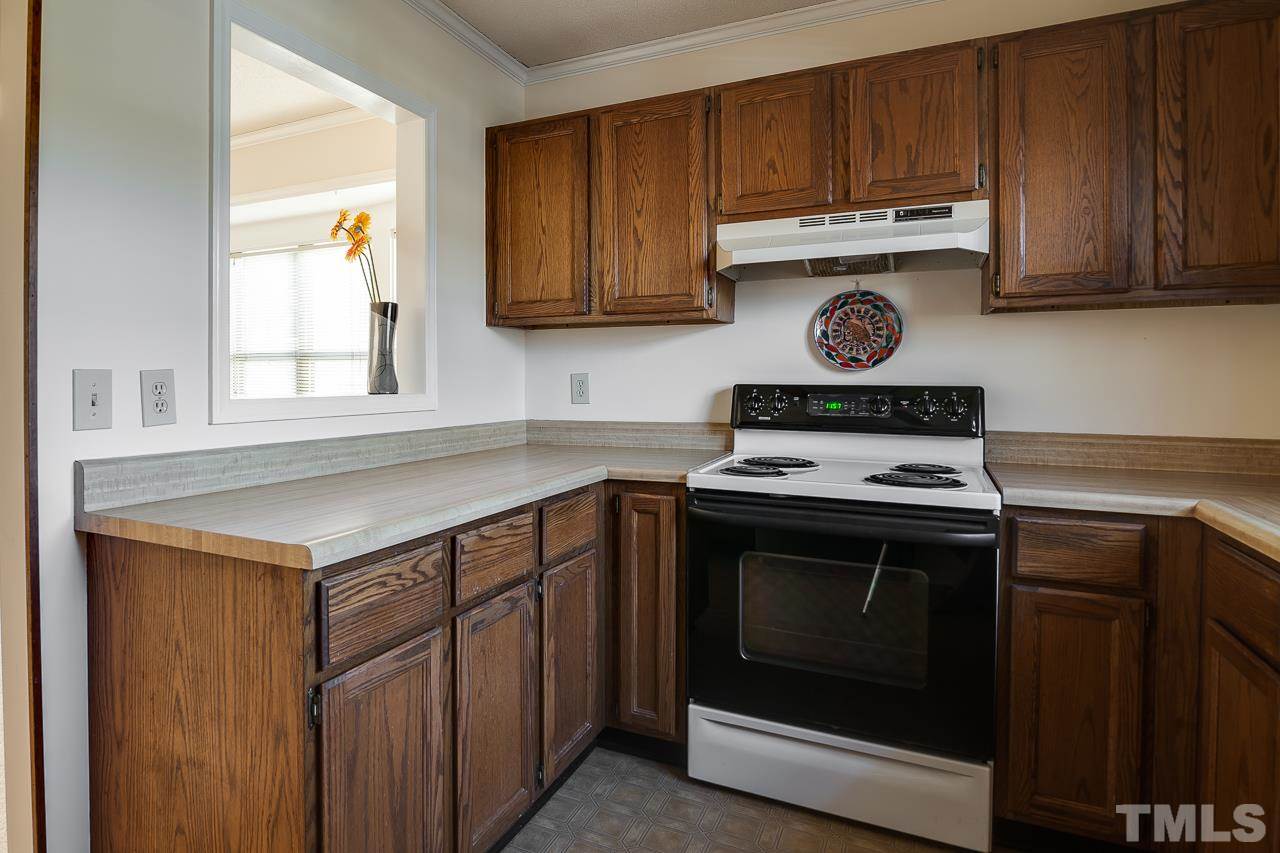5429 Pine Top Circle Raleigh, NC 27612 - Photo 16 of 24 Kitchen is open to dining room.