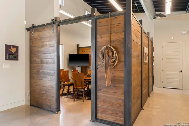 a view of a hallway with a outdoor space