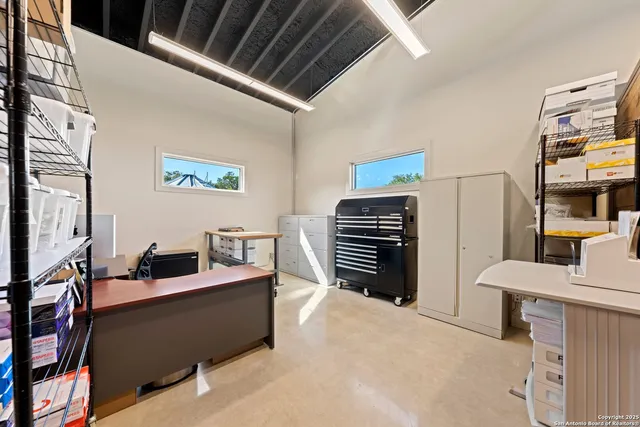 a bedroom with furniture and a window