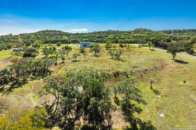 a view of a large body of water with a building in the background