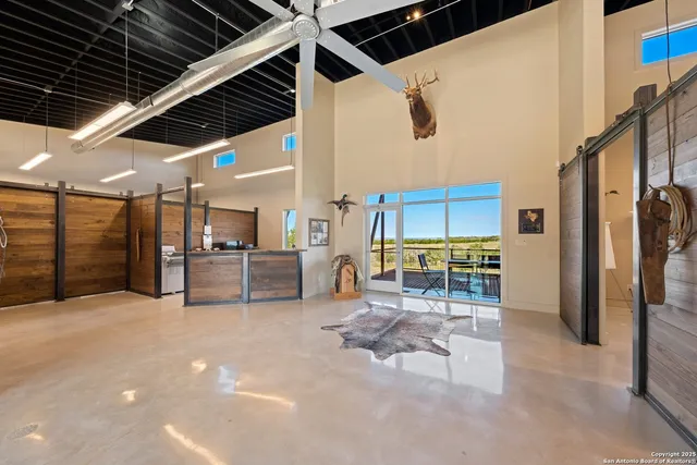 a building with glass top table and chairs