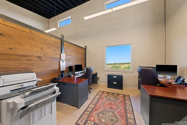 a living room with a flat screen tv and a fireplace
