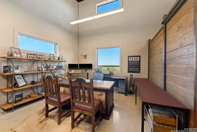 a dining room with furniture and a window