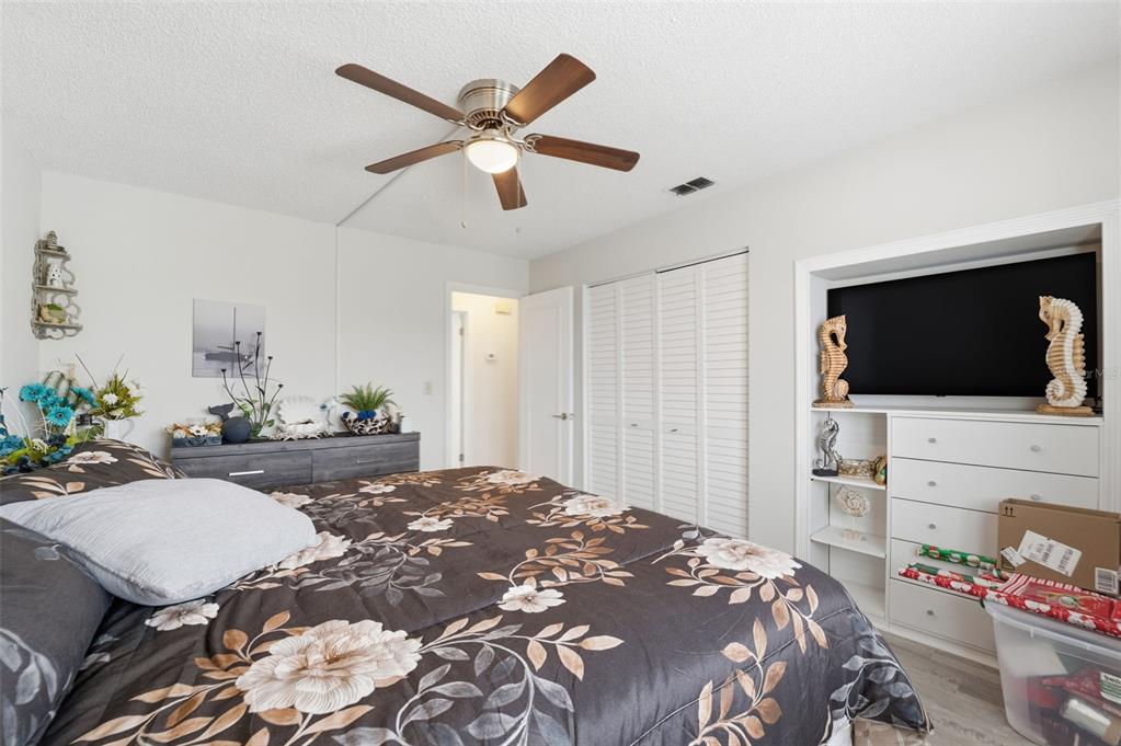 3366 Bluefish Drive Hernando Beach, FL 34607 - Photo 70 of 75 a bedroom with a bed and a flat screen tv