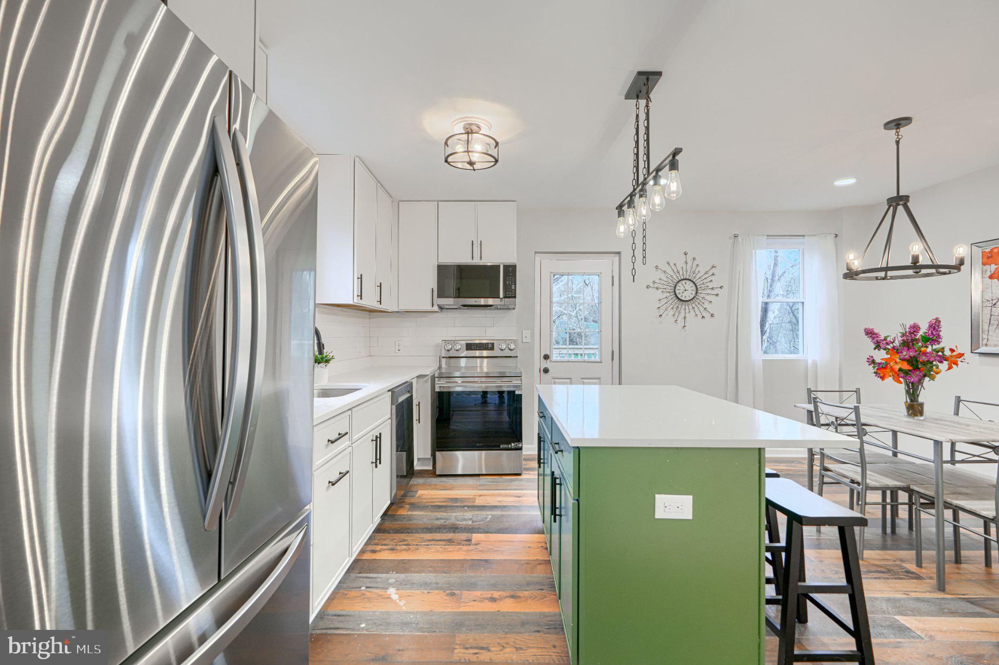 2345 Paper Mill Road Phoenix, MD 21131 - Photo 9 of 49 Modern kitchen with vibrant accents.