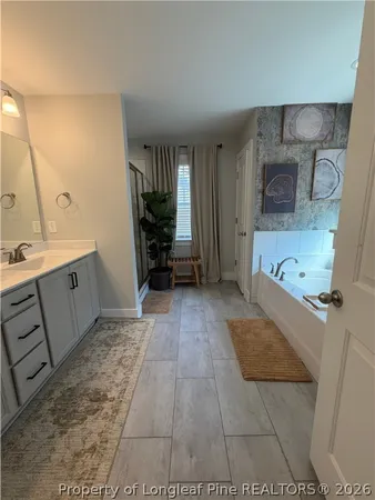 a view of kitchen with sink and cabinets
