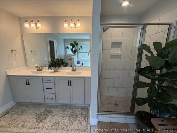 a bath room with a toilet and a tub