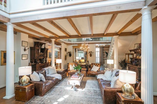 a outdoor dining space with furniture and wooden floor