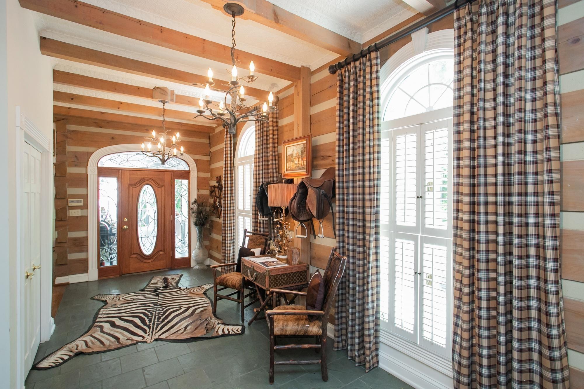 1105 Mt Pleasant Road Kingston Springs, TN 37082 - Photo 32 of 97 a living room with furniture and a chandelier