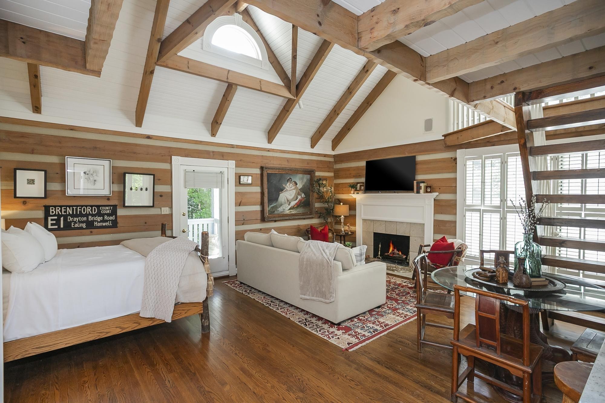 1105 Mt Pleasant Road Kingston Springs, TN 37082 - Photo 51 of 97 a living room with furniture a fireplace and a floor to ceiling window