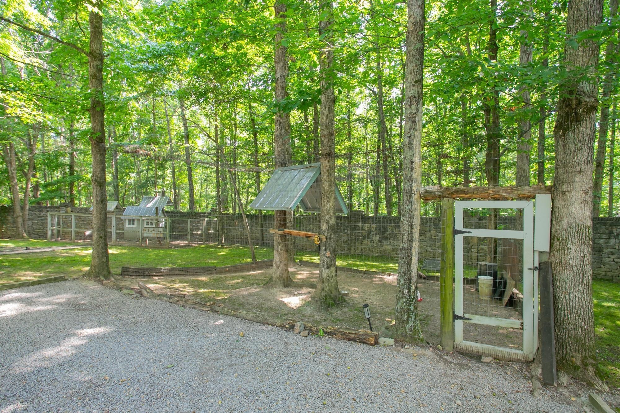 1105 Mt Pleasant Road Kingston Springs, TN 37082 - Photo 70 of 97 a view of a park that has large trees and a small yard