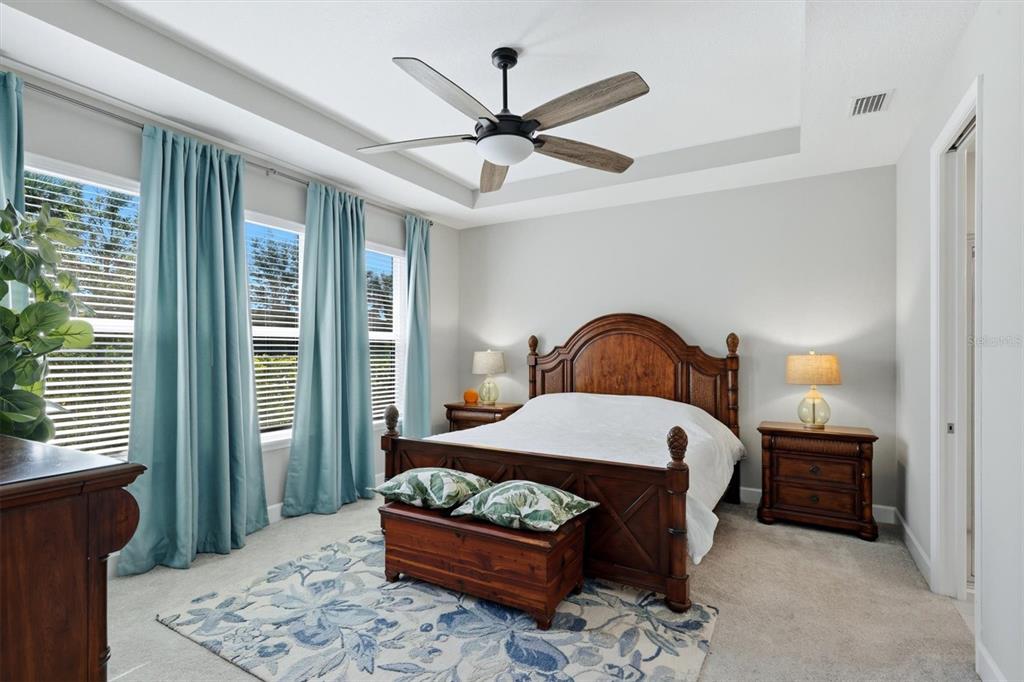 9268 Tequila Sunrise Drive Sarasota, FL 34241 - Photo 19 of 56 a bedroom with a bed and a window
