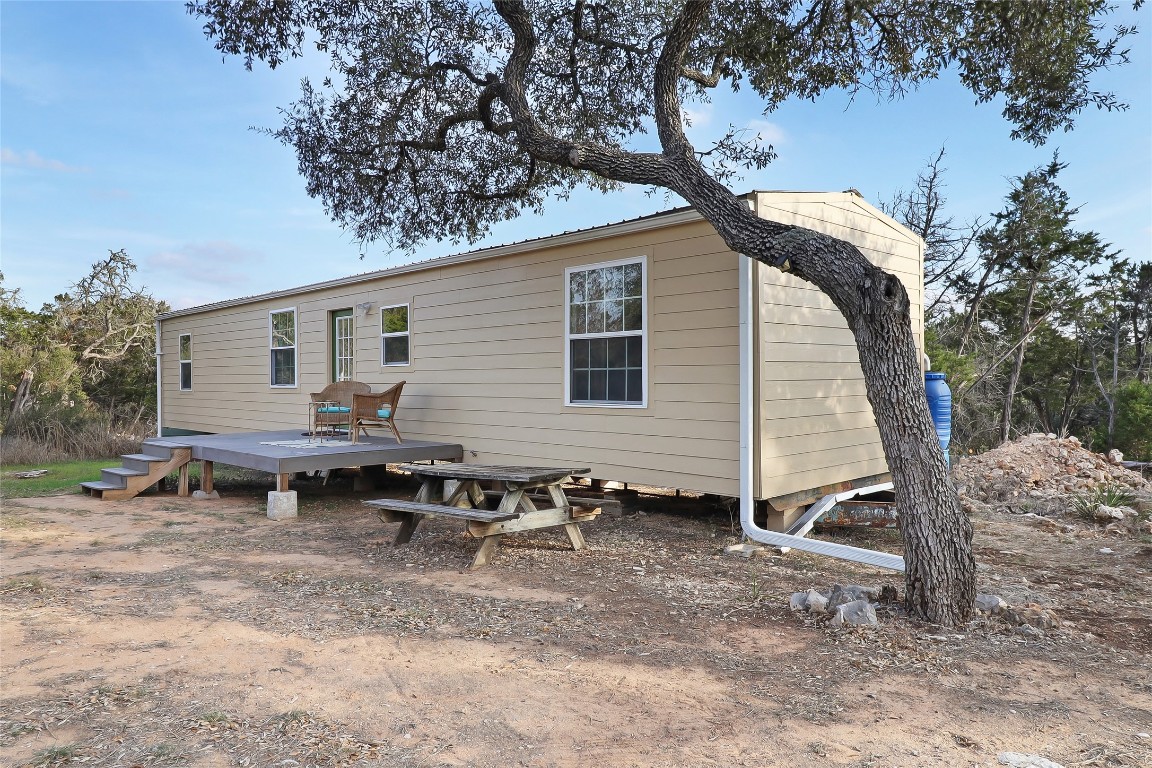 901 Thurman Road San Marcos, TX 78666 - Photo 23 of 32 Side view of property featuring a wooden deck