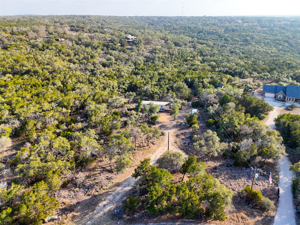901 Thurman Road San Marcos, TX 78666 - Photo 25 of 32 Aerial view of property and surrounding area featuring a forest
