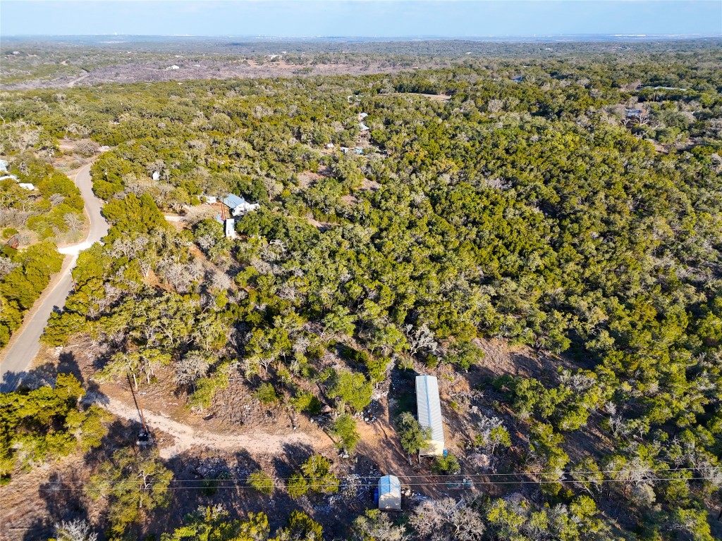 901 Thurman Road San Marcos, TX 78666 - Photo 29 of 32 Aerial view of property and surrounding area with a forest