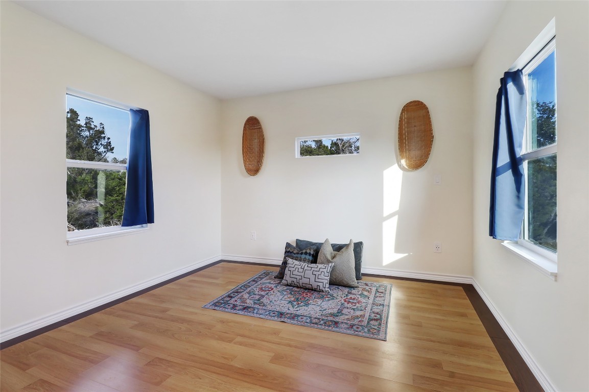 901 Thurman Road San Marcos, TX 78666 - Photo 3 of 32 Primary bedroom with Hill Country views