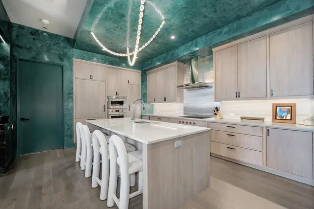 a kitchen that has a cabinets and a stove