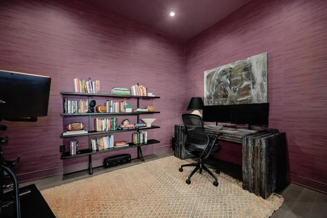 a view of a livingroom with workspace and a couch