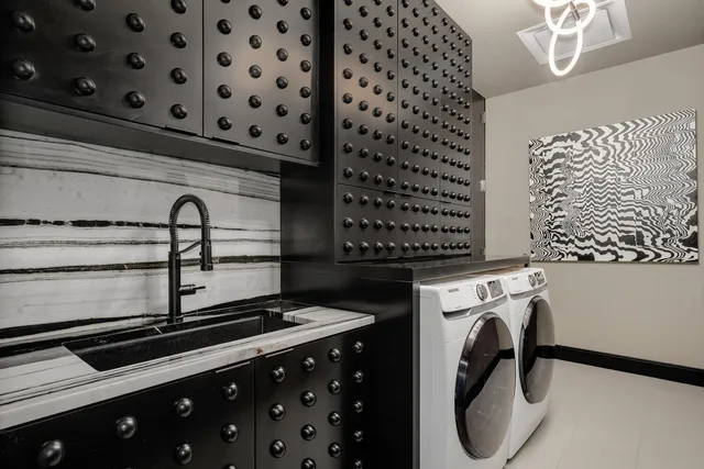 a kitchen with granite countertop a stove and a sink