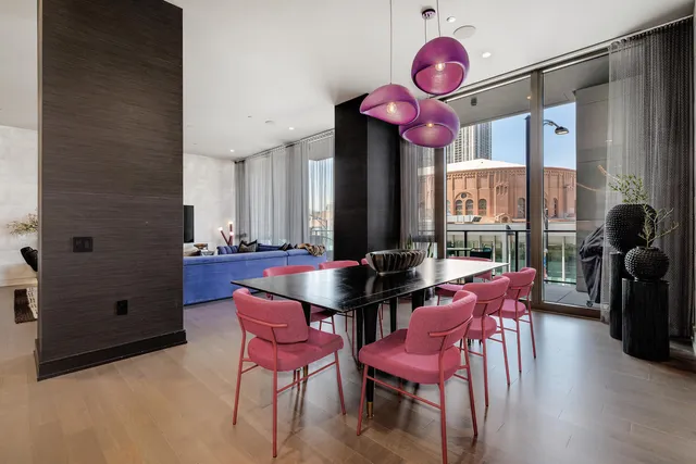 a dining room with furniture and wooden floor
