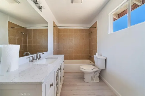 a bathroom with a toilet a sink and a shower
