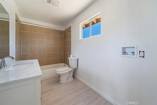 a kitchen with granite countertop a stove and a sink