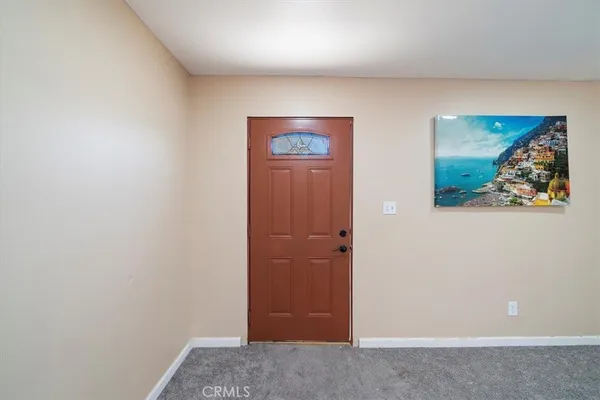 a house that has a tree in front of it