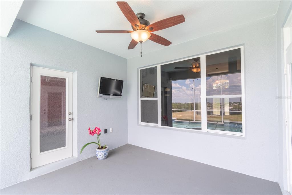 3862 Beacon Ridge Way Clermont, FL 34711 - Photo 44 of 56 a room with window and flat screen tv