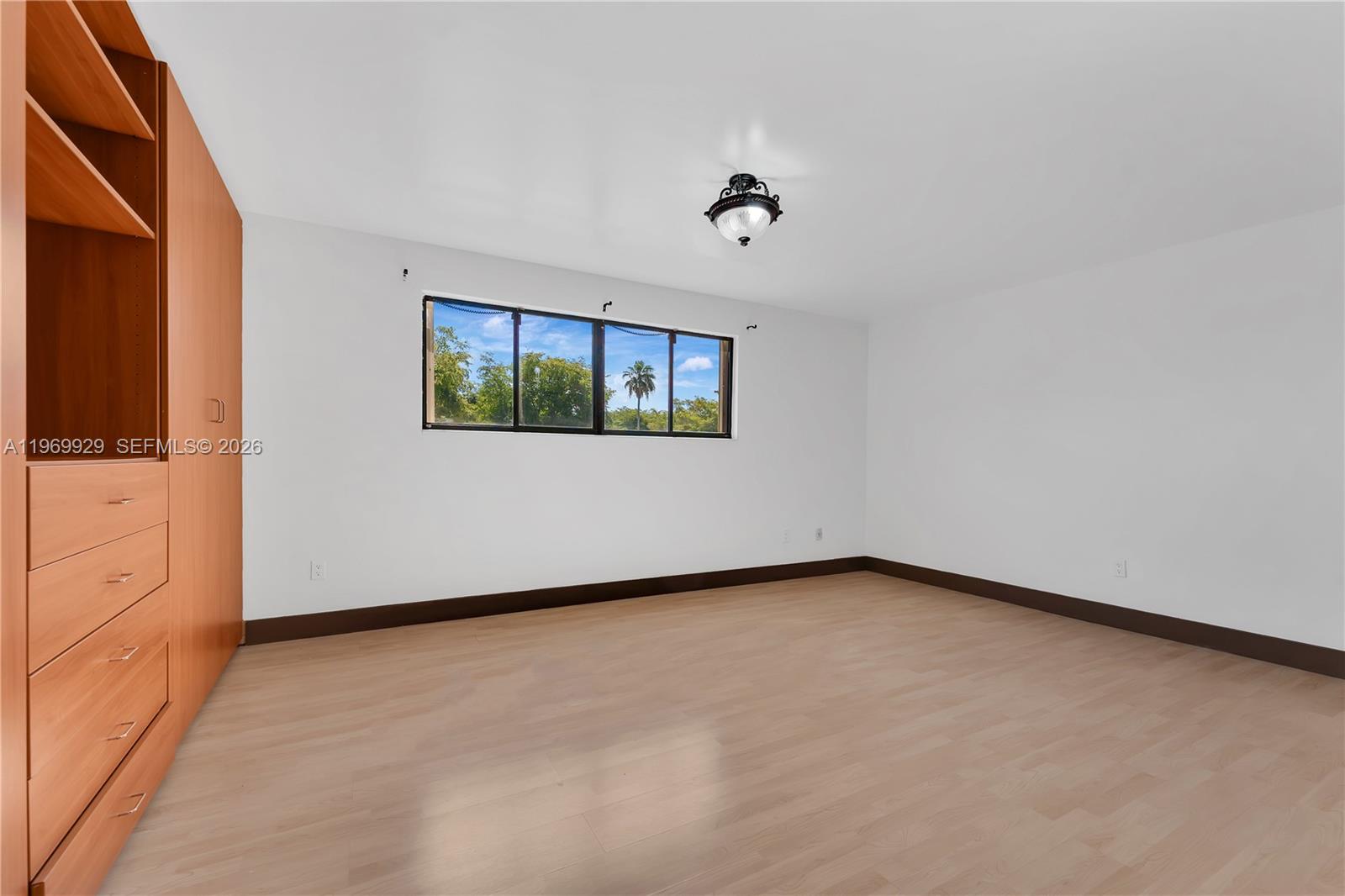 9646 Southwest 151st Avenue, Unit 1 Miami, FL 33196 - Photo 11 of 26 an empty room with windows