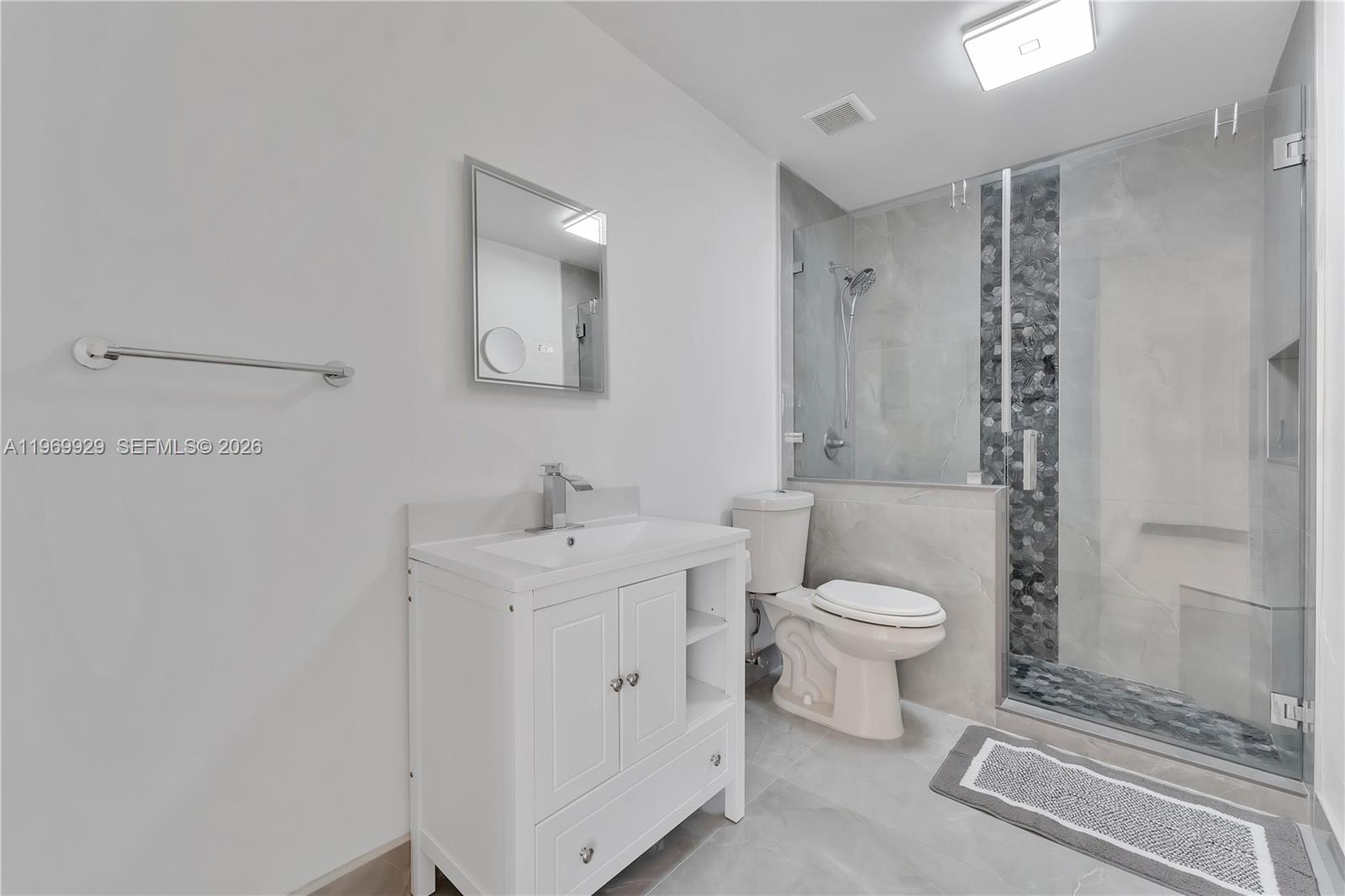 9646 Southwest 151st Avenue, Unit 1 Miami, FL 33196 - Photo 13 of 26 a bathroom with a toilet sink and a shower