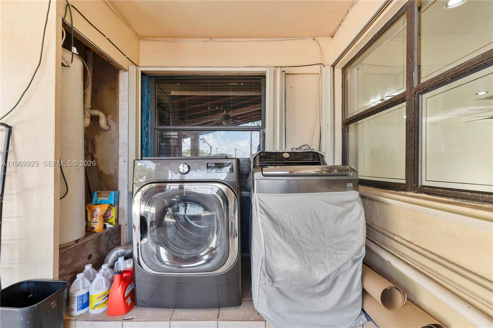 9646 Southwest 151st Avenue, Unit 1 Miami, FL 33196 - Photo 18 of 26 a utility room with dryer and washer