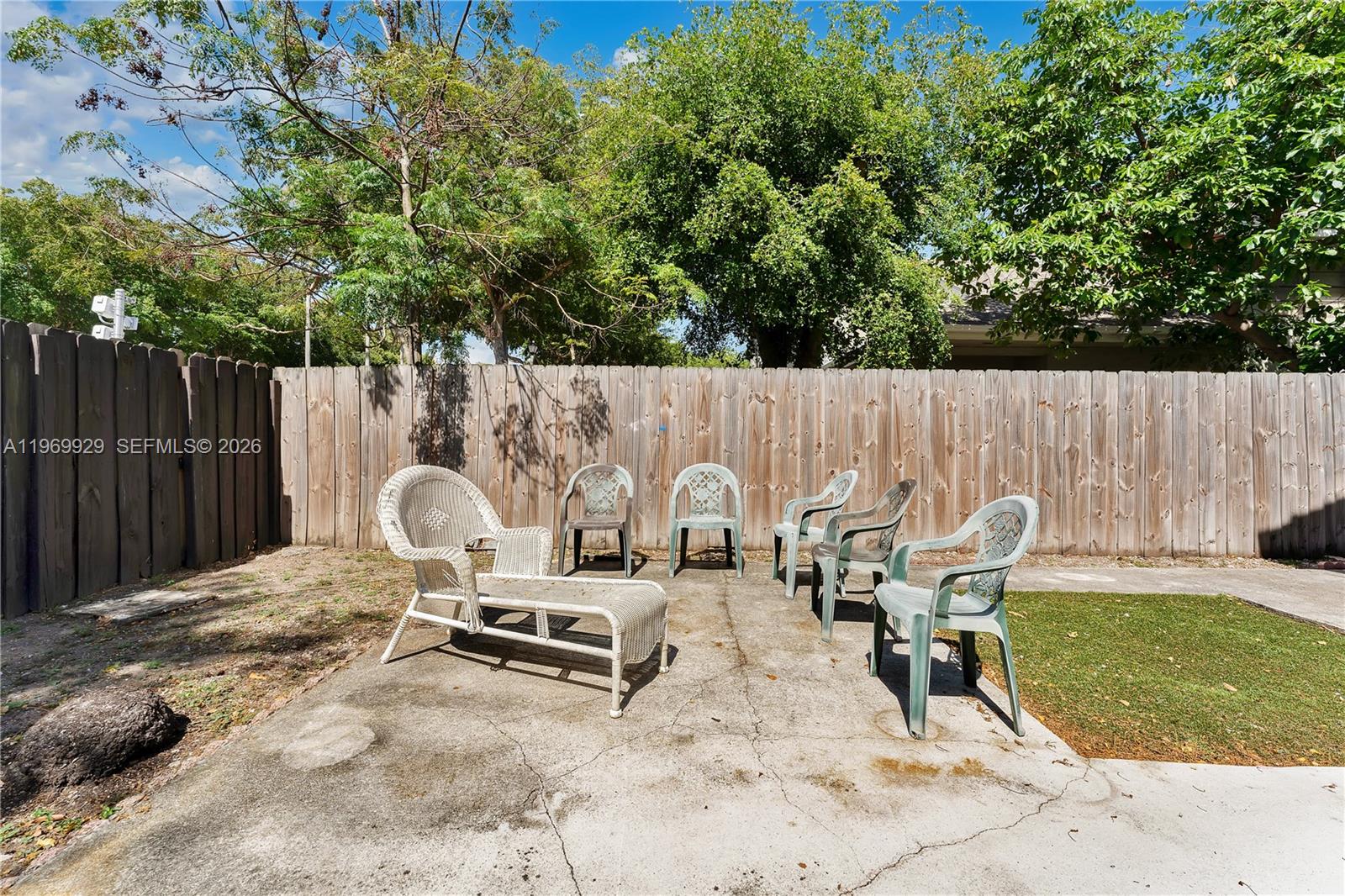 9646 Southwest 151st Avenue, Unit 1 Miami, FL 33196 - Photo 19 of 26 a view of a outdoor space with a patio and outdoor seating