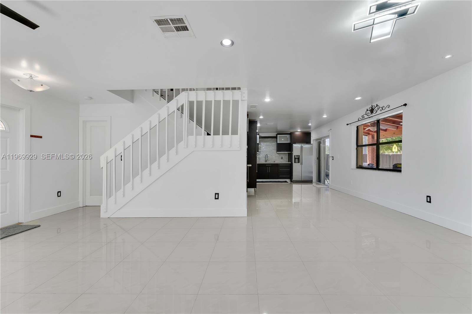 9646 Southwest 151st Avenue, Unit 1 Miami, FL 33196 - Photo 3 of 26 en view interior of a house with an entryway and stairs
