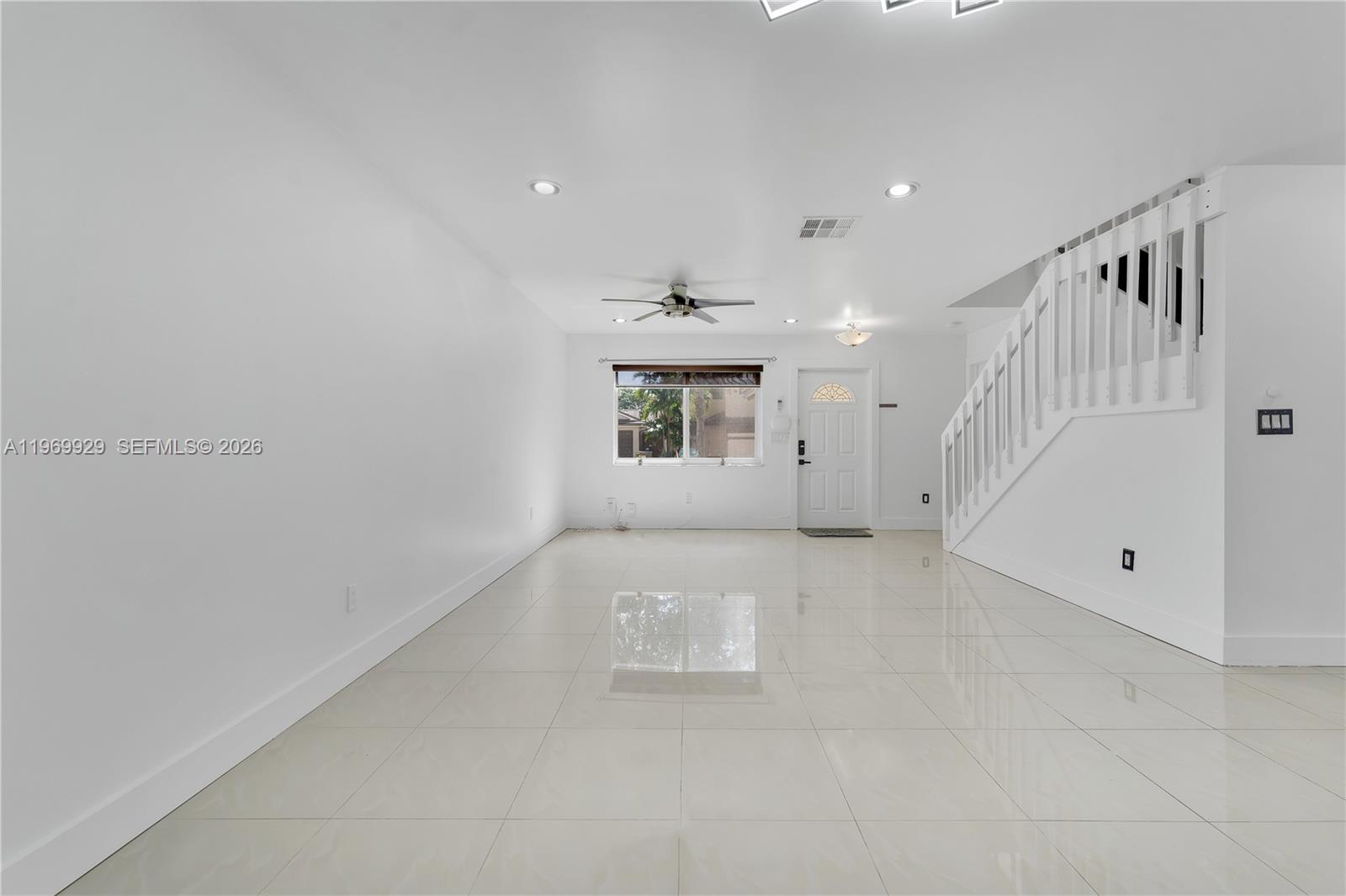 9646 Southwest 151st Avenue, Unit 1 Miami, FL 33196 - Photo 5 of 26 a view of an empty room with a window