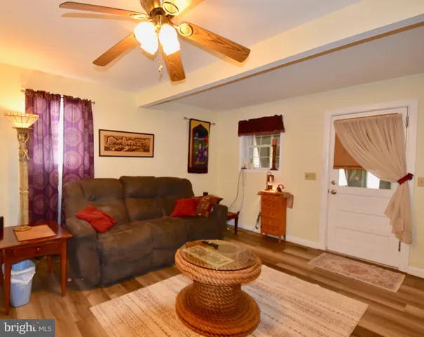 a kitchen with a sink stove top oven and microwave