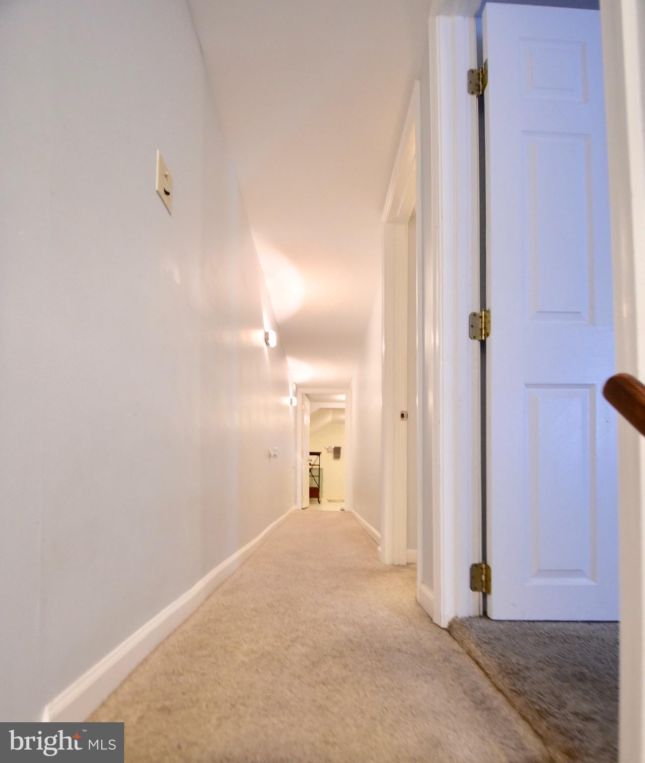 211 Choptank Avenue Cambridge, MD 21613 - Photo 22 of 52 a view of a hallway with wooden floor