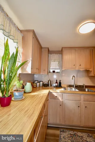 a kitchen with a stove and microwave