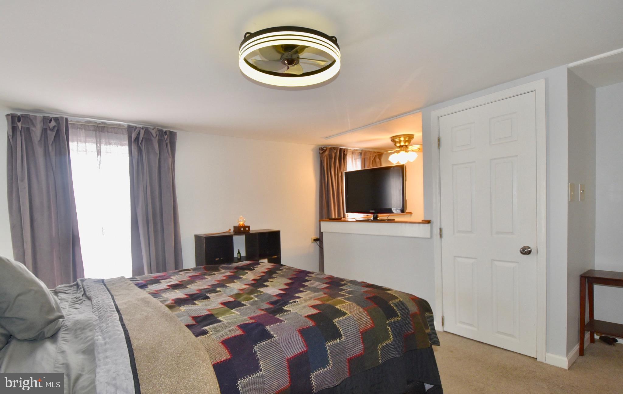 211 Choptank Avenue Cambridge, MD 21613 - Photo 24 of 52 a bedroom with a bed and a window