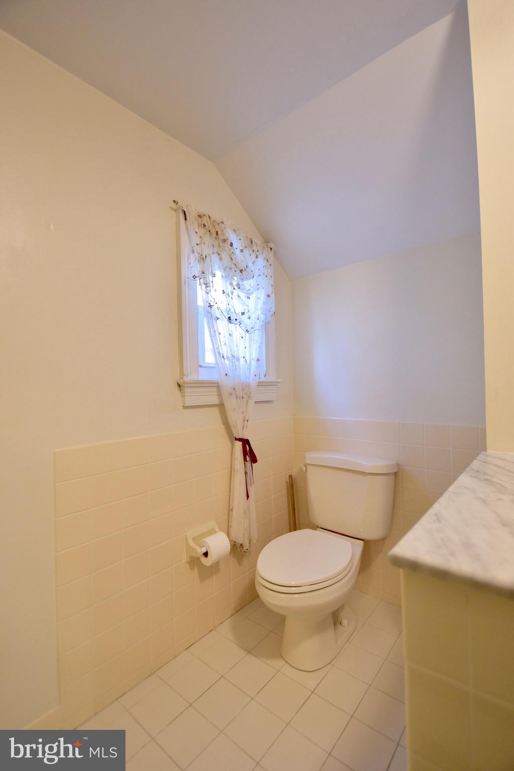 211 Choptank Avenue Cambridge, MD 21613 - Photo 27 of 52 a white toilet sitting next to a bathroom sink