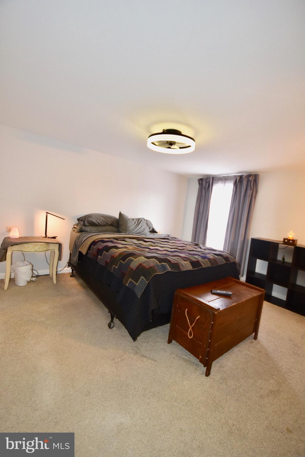 211 Choptank Avenue Cambridge, MD 21613 - Photo 31 of 52 a bedroom with a bed and a lamp