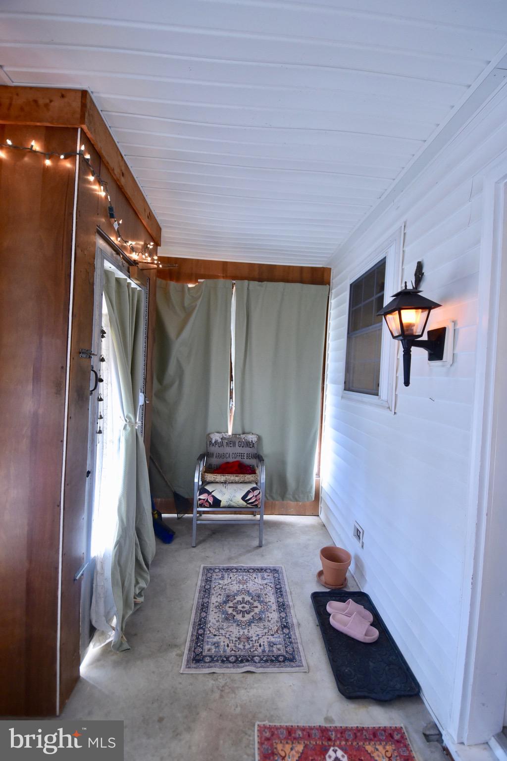 211 Choptank Avenue Cambridge, MD 21613 - Photo 38 of 57 a living room with furniture and a rug