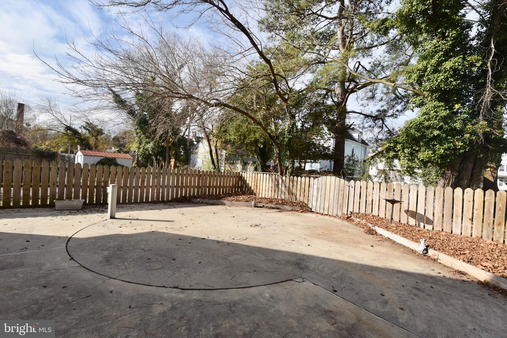 211 Choptank Avenue Cambridge, MD 21613 - Photo 39 of 57 a street view with wooden fence