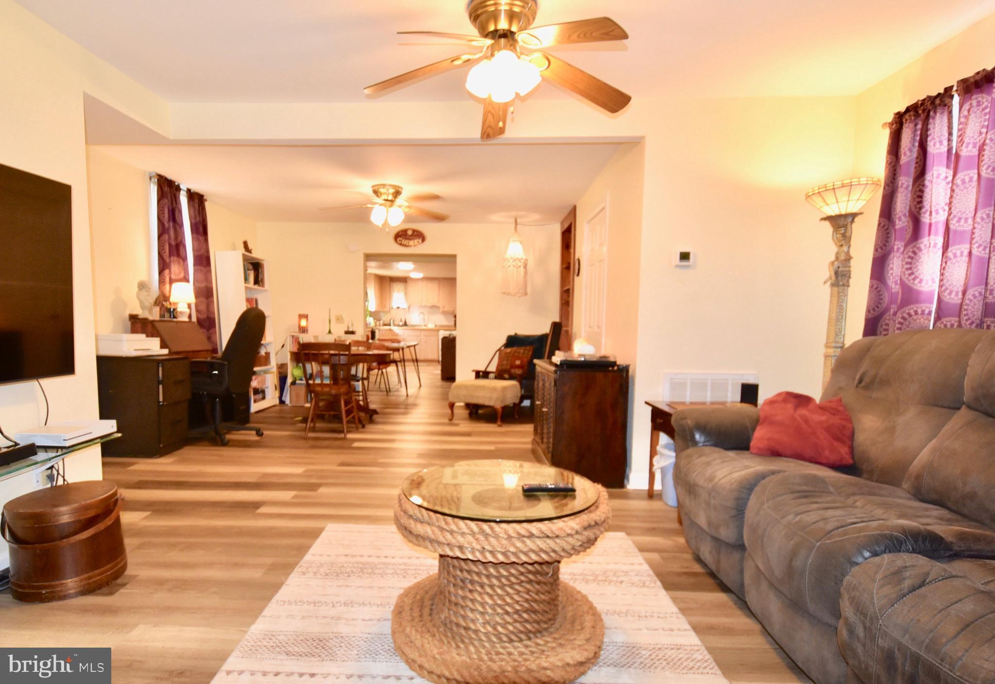 211 Choptank Avenue Cambridge, MD 21613 - Photo 4 of 57 a living room with lots of furniture and a large window