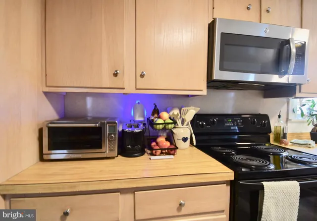 a view of a chairs and tables in the back yard of the house