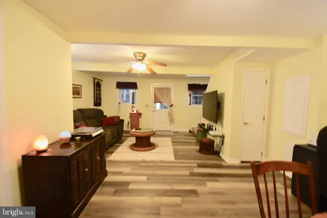 a view of a backyard with table and chairs and a fire pit