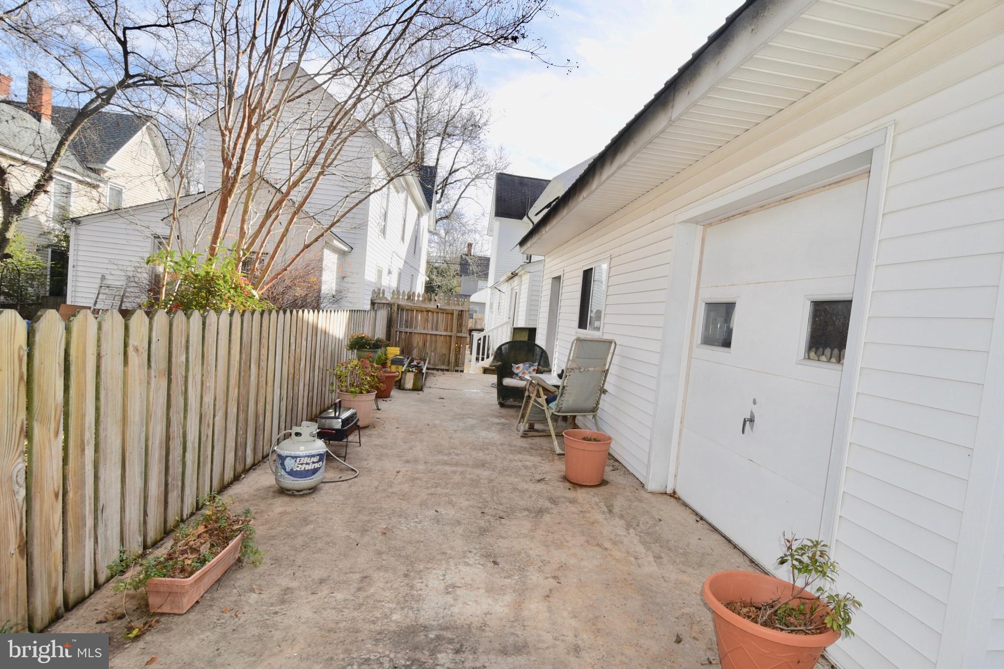 211 Choptank Avenue Cambridge, MD 21613 - Photo 53 of 57 a view of a backyard with table and chairs and a fire pit