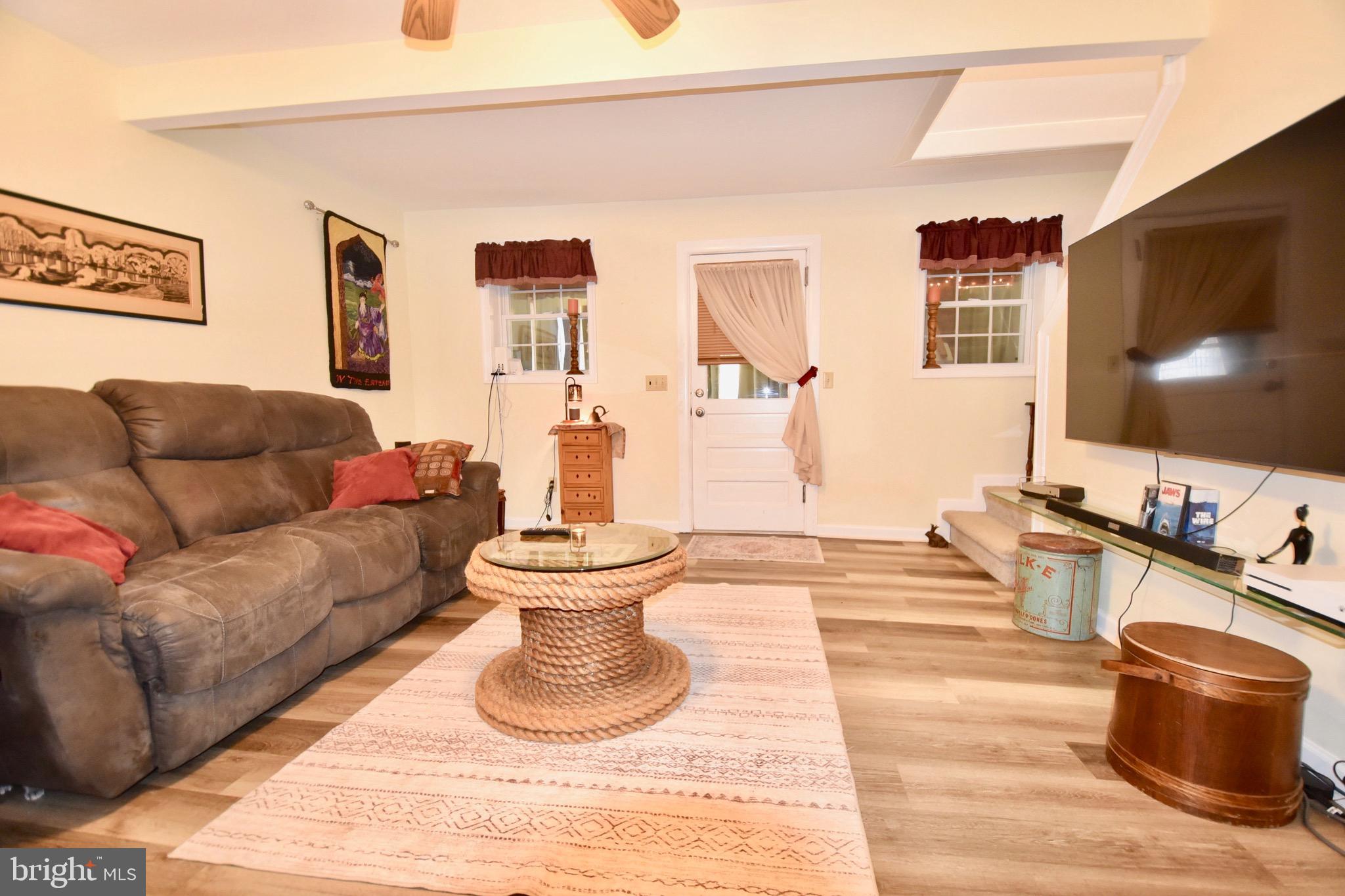 211 Choptank Avenue Cambridge, MD 21613 - Photo 6 of 57 a living room with furniture and a flat screen tv