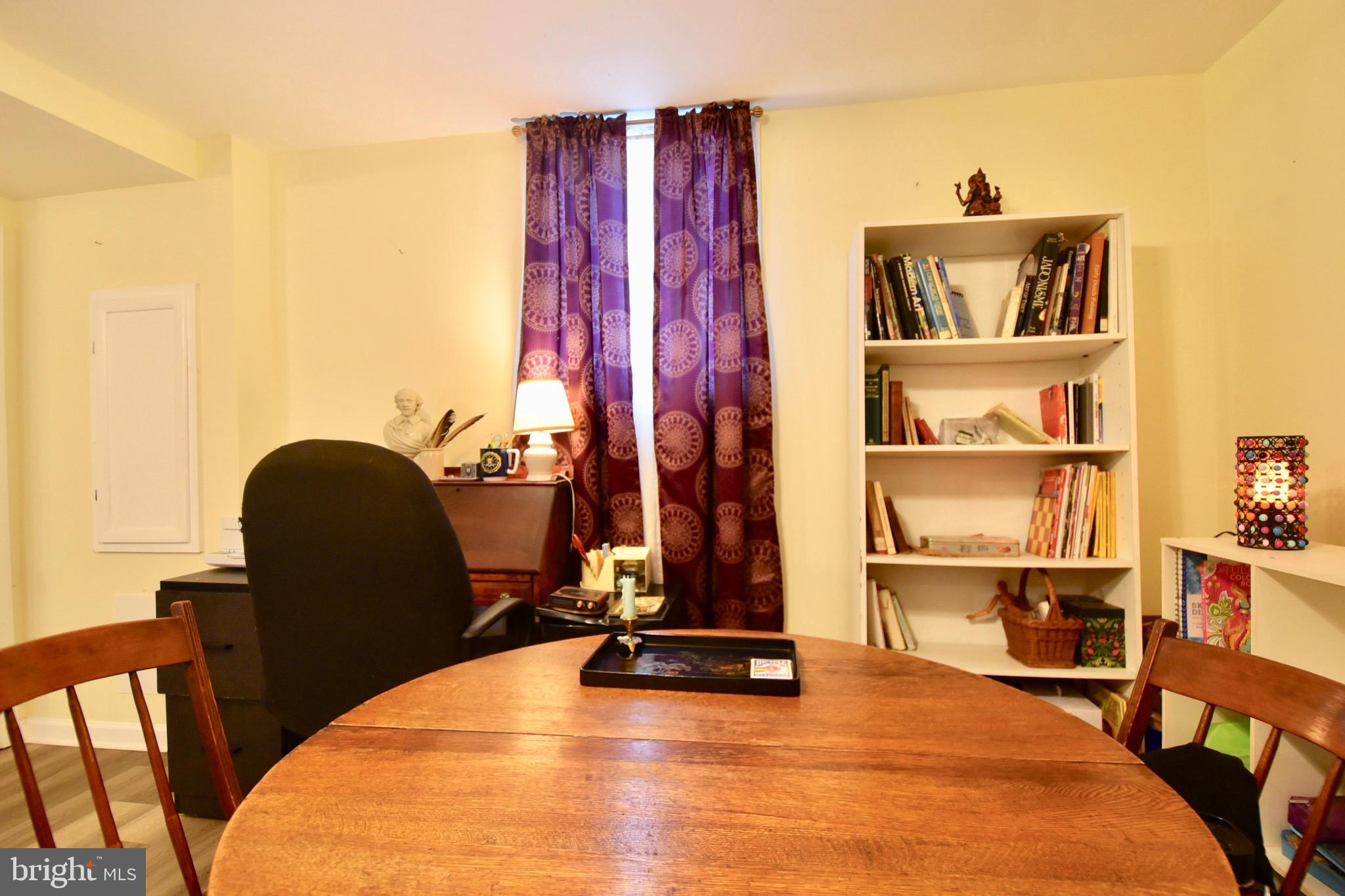 211 Choptank Avenue Cambridge, MD 21613 - Photo 7 of 57 a view of a workspace with furniture and wooden floor