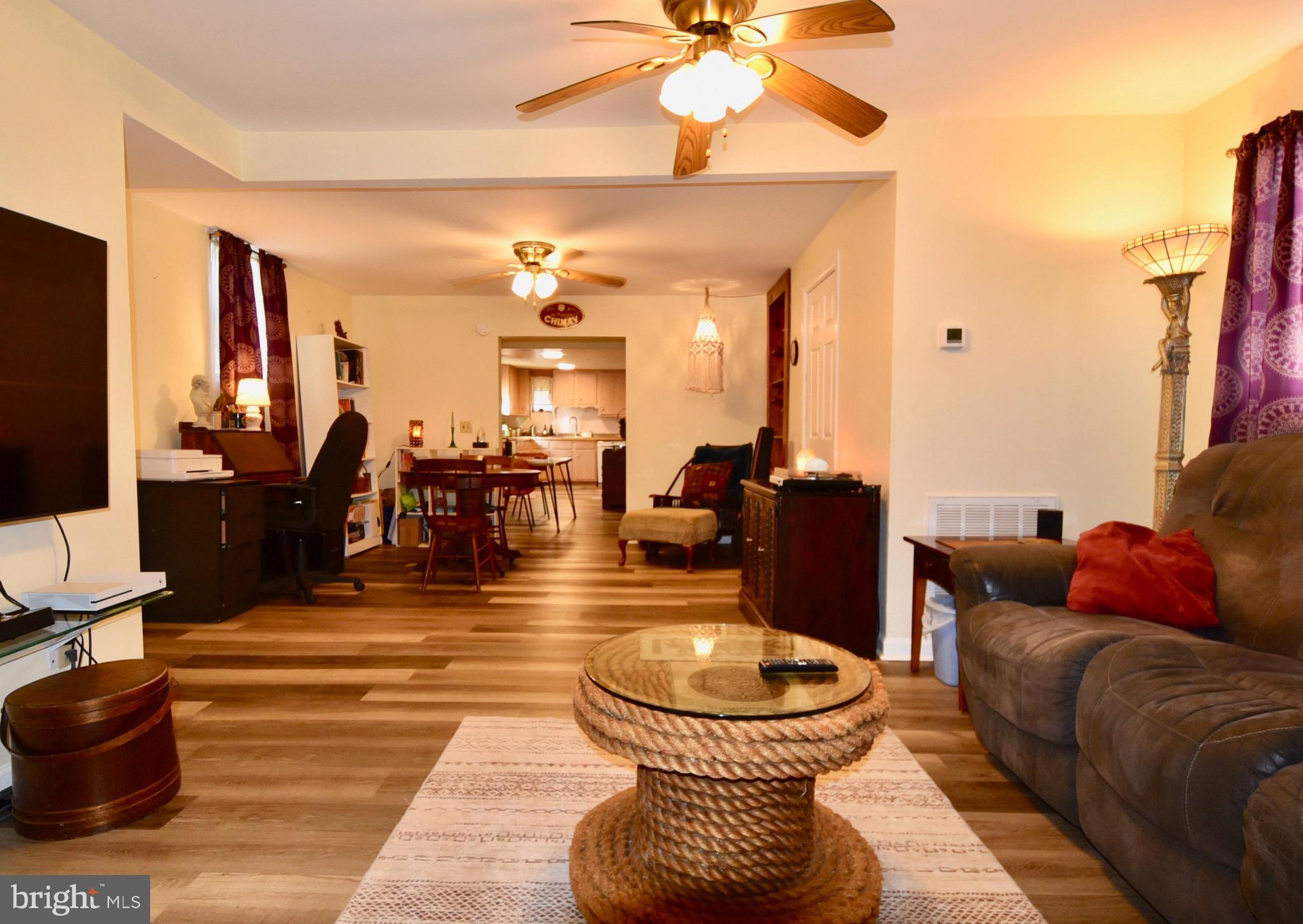 211 Choptank Avenue Cambridge, MD 21613 - Photo 8 of 57 a living room with furniture and a flat screen tv